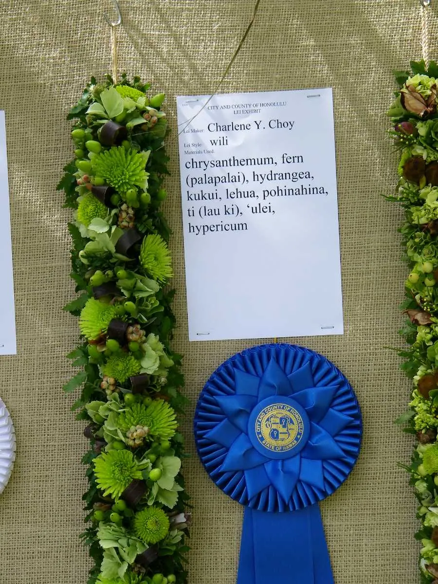 Close-up of intricate flower lei being made