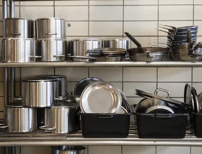 Close-up of pots and pans in a professional kitchen setting, typical of Culinary Schools In Montana