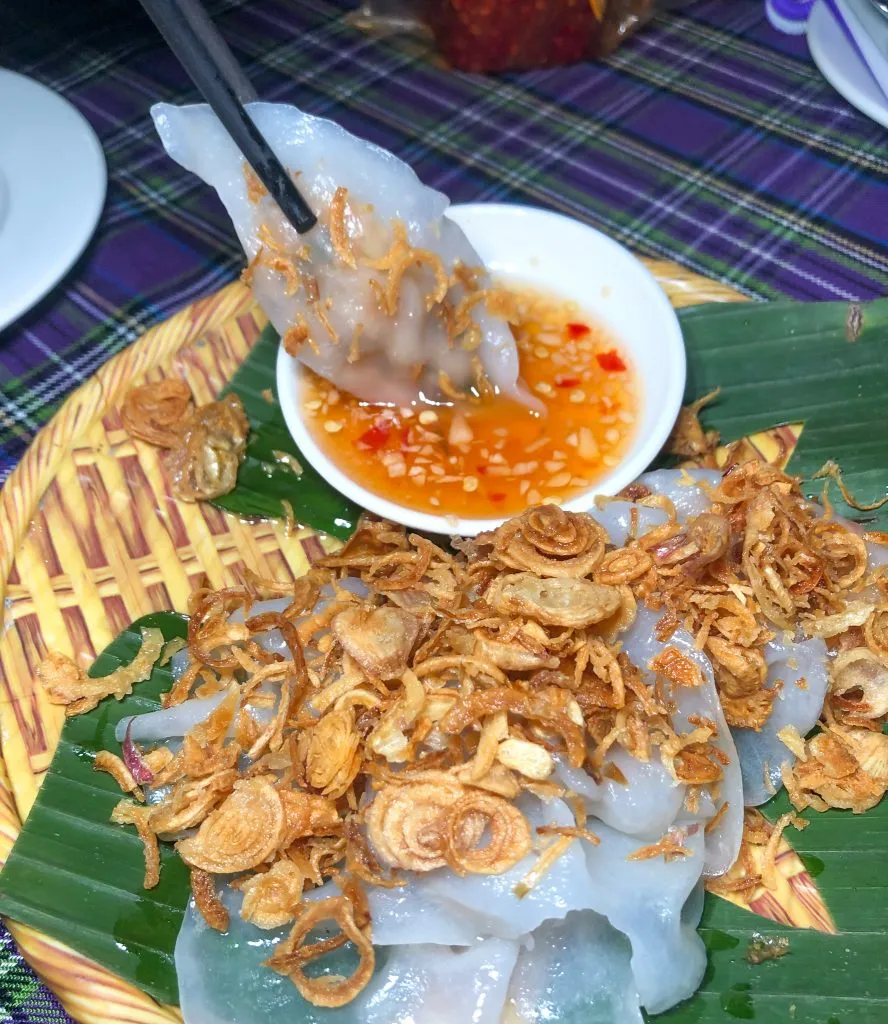 Close-up of White Rose dumplings garnished with crispy shallots
