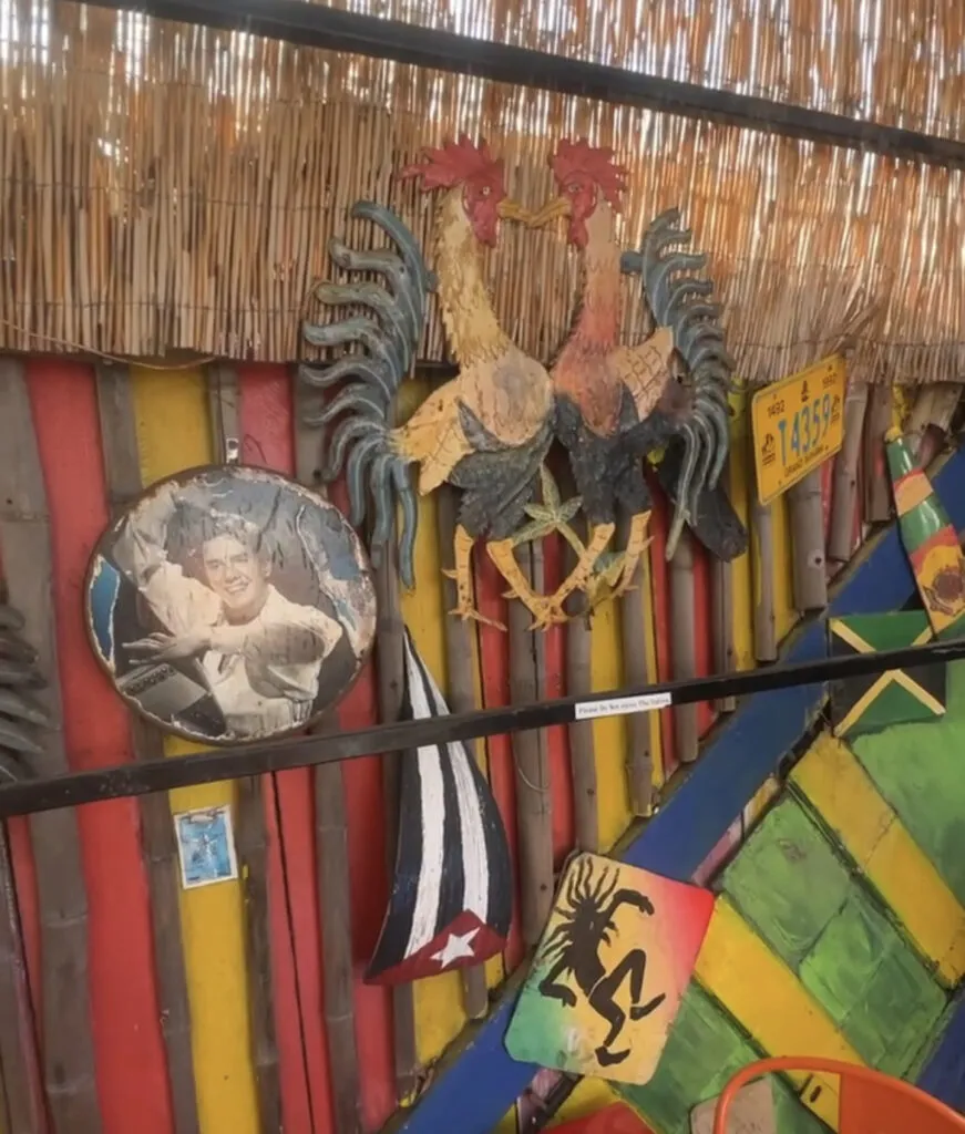 Colorful interior decor with a rooster at Cha Cha Chicken near Santa Monica Pier