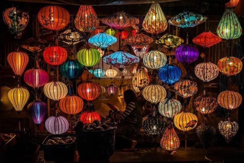 Colorful lanterns lighting up the streets of Hoi An at night, creating a magical atmosphere