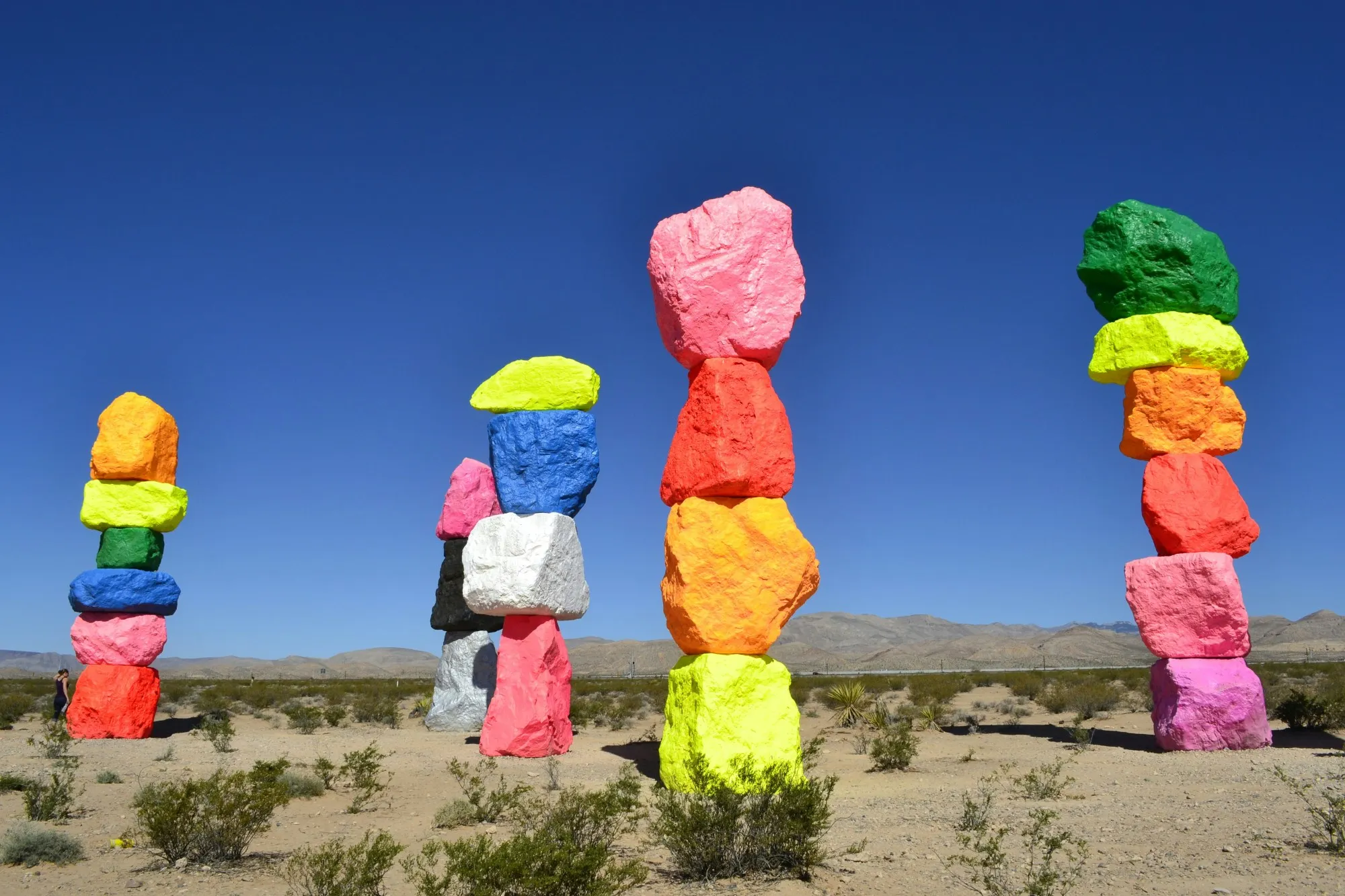 Colorful rocks stacked on top of each other in the desert.