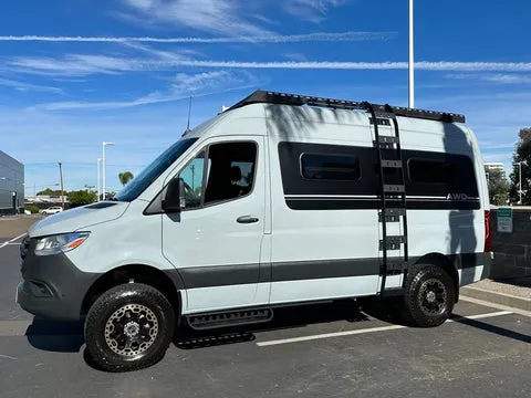 Comfortable interior of a van life setup, ready for an overnight stay.