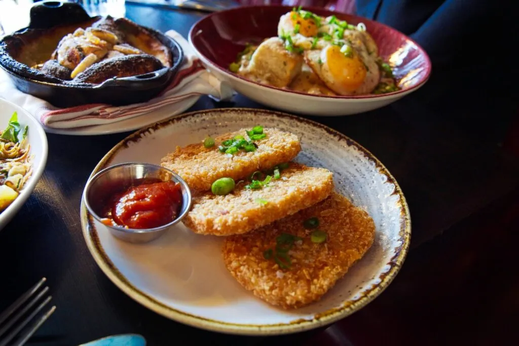 Crispy fried hash browns from Bar Dough, a delightful side dish during brunch in Denver.