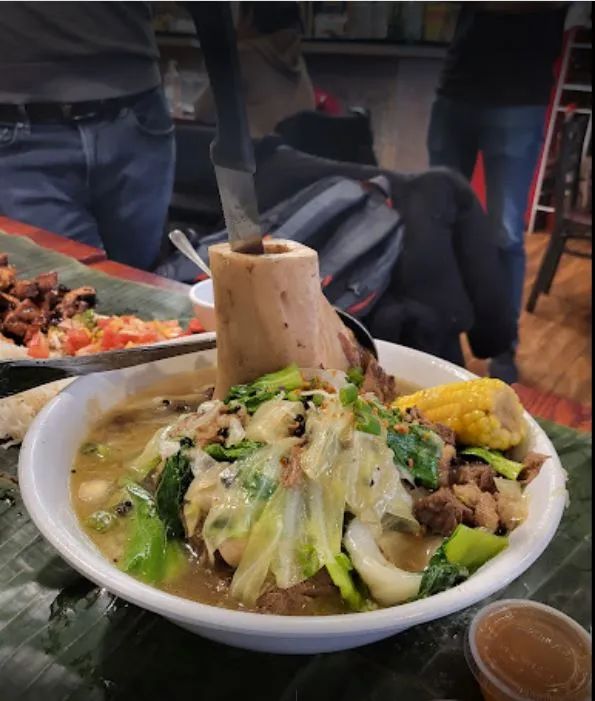 Crispy Lechon Kawali served at a Filipino restaurant, typical of offerings at Kabayan on Queens Blvd