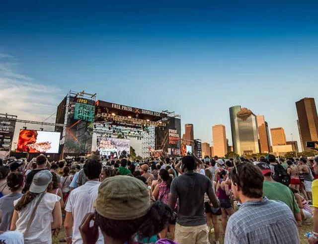 Crowd enjoying a large music festival, typical of Houston festivals.