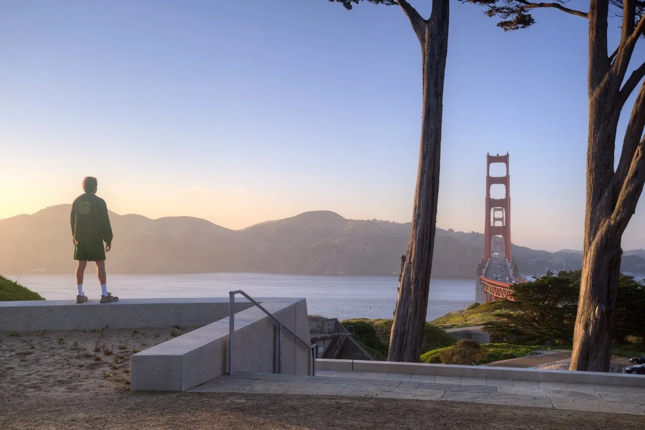 Cyclists crossing the Golden Gate Bridge San Francisco during sunset