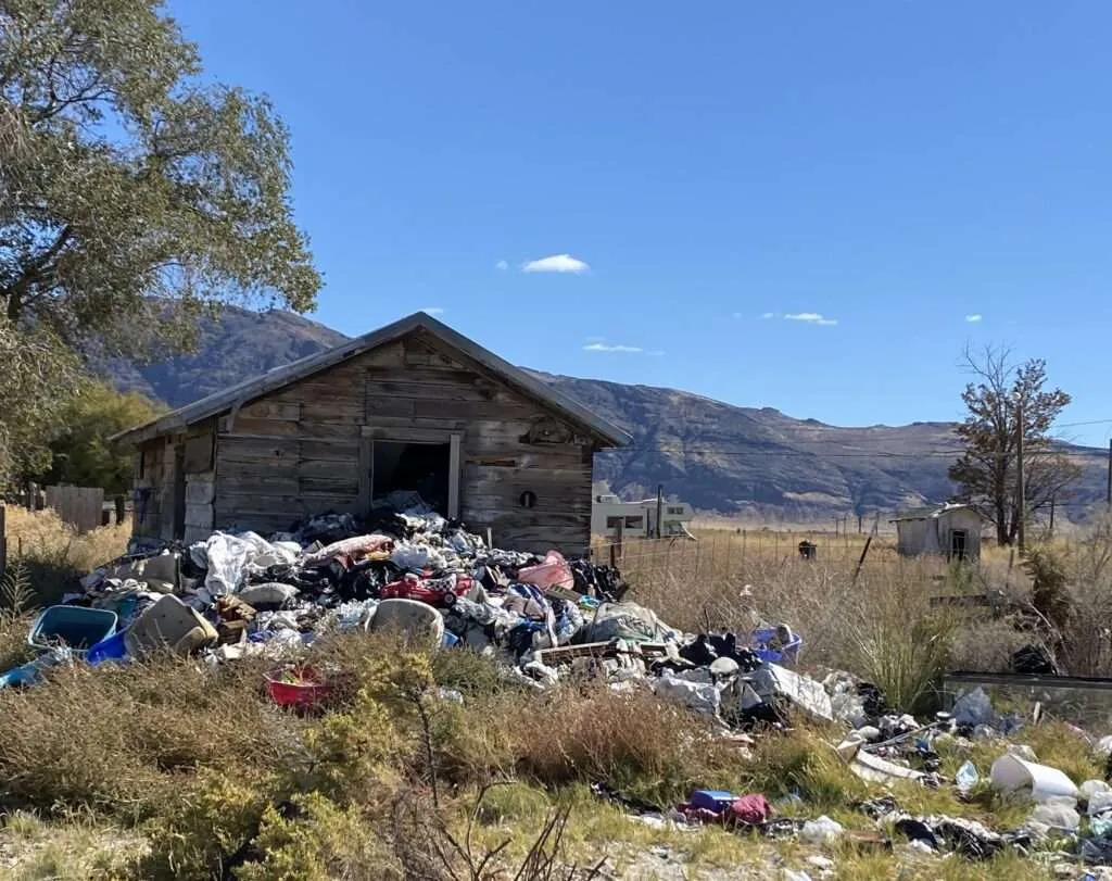 Debris and trash scattered along a road in the outskirts of Wendel