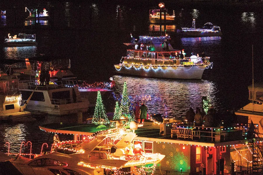 Decorated boats on the Potomac River for The District Holiday Boat Parade, a waterfront spectacle during Travel To Washington Dc In December.