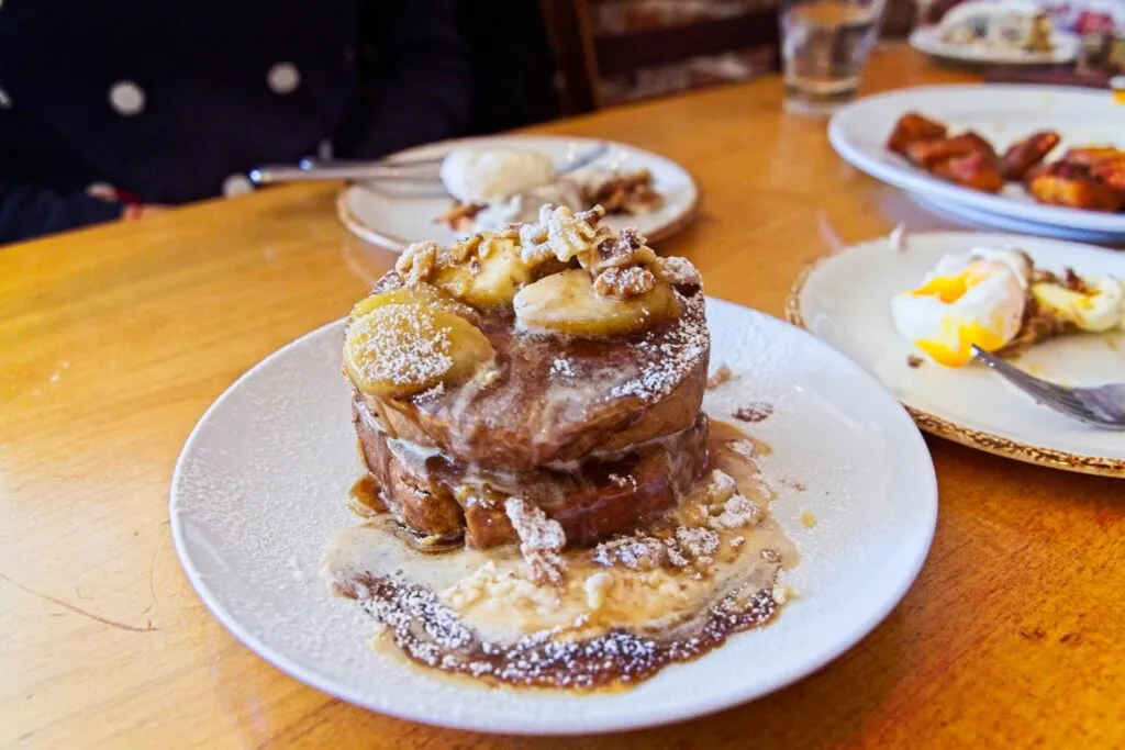 Delicious Bananas Foster French Toast made with banana bread at Duo restaurant, a top spot for brunch in Denver.