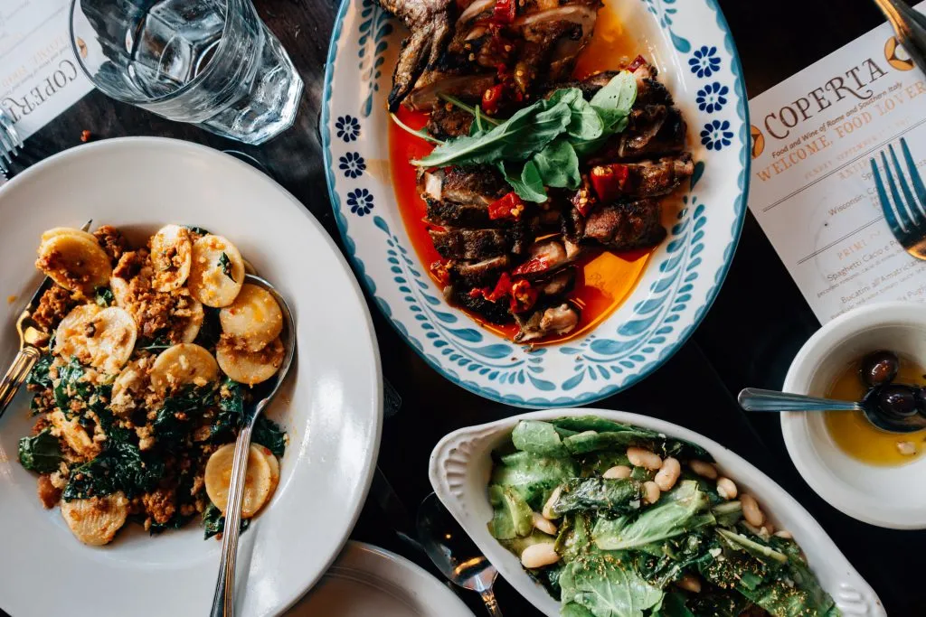 Delicious Italian pasta dishes served on plates at Coperta restaurant, a favorite place to eat in Denver Colorado