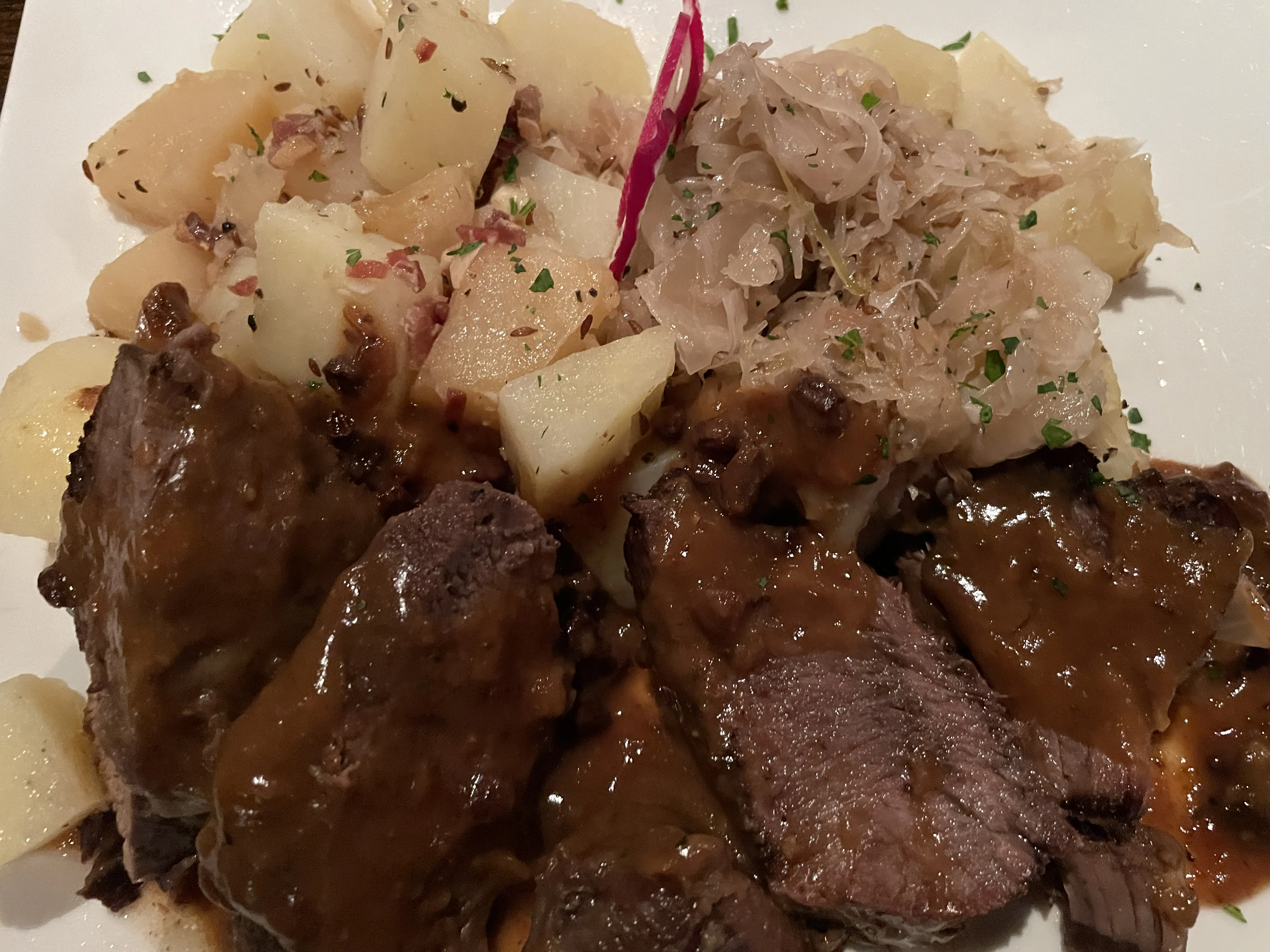 Delicious sauerbraten with sides at The Edge restaurant
