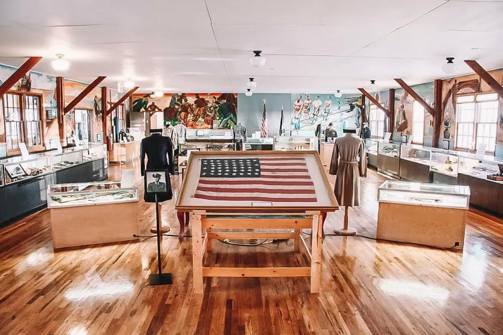 Display with American flag and exhibits at the Wyoming Veterans Memorial Museum in Casper - Memorial Things To See And Do In Wyoming