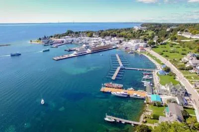 Drone view of Mackinac Island, highlighting the downtown and surrounding trees