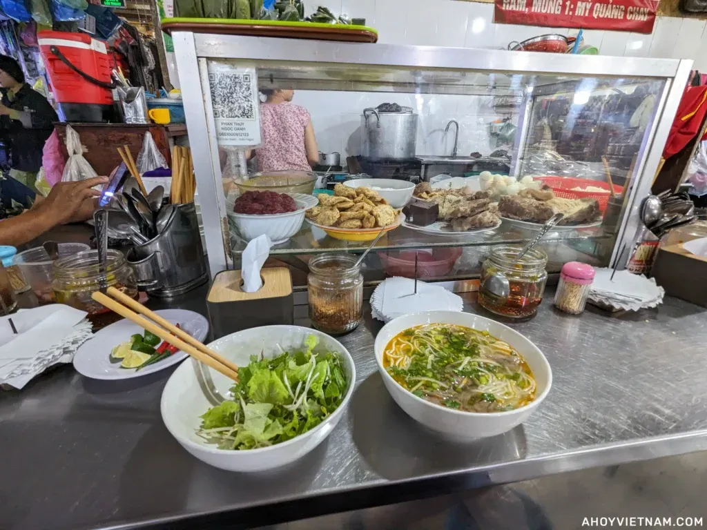 Eating bun bo Hue inside the My An Market in Da Nang.