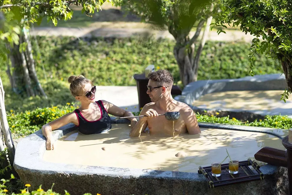 Enjoying a traditional Vietnamese spa treatment, a relaxing activity in Vietnam