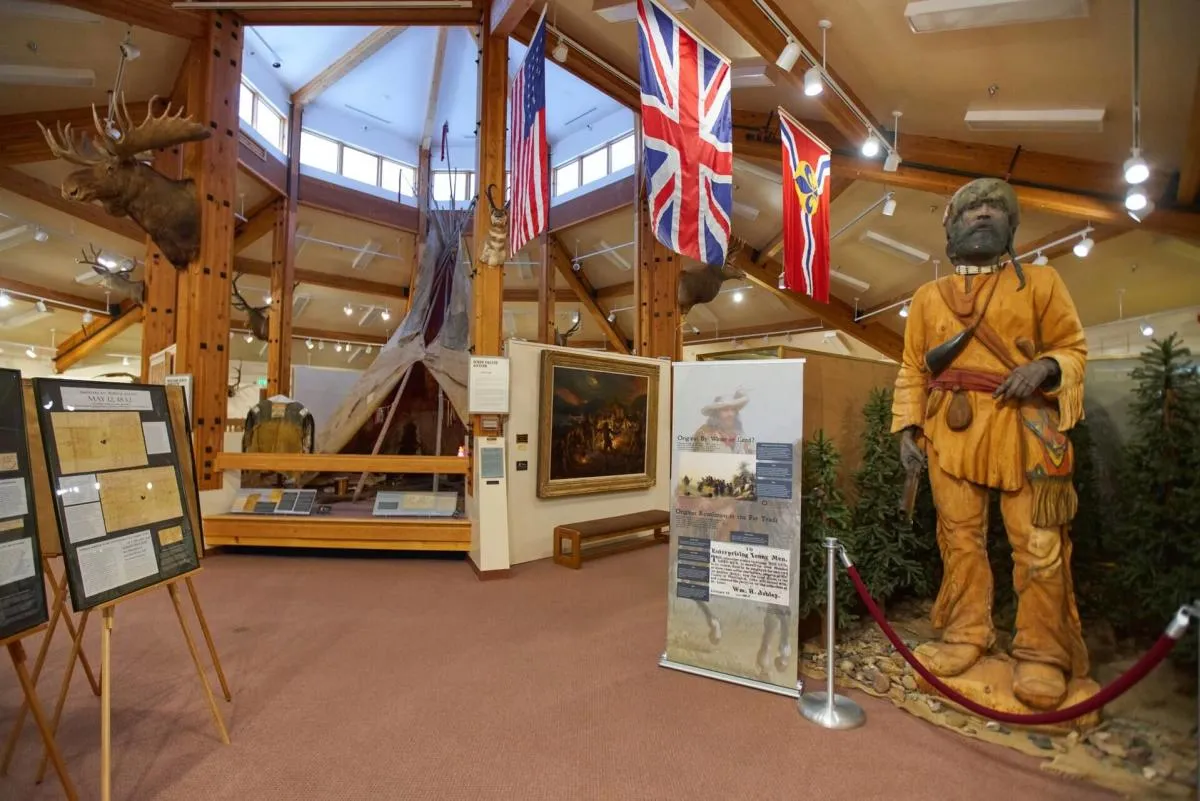 Exhibits featuring saddles and Western artifacts inside the Museum of the Mountain Man - History Things To See And Do In Wyoming