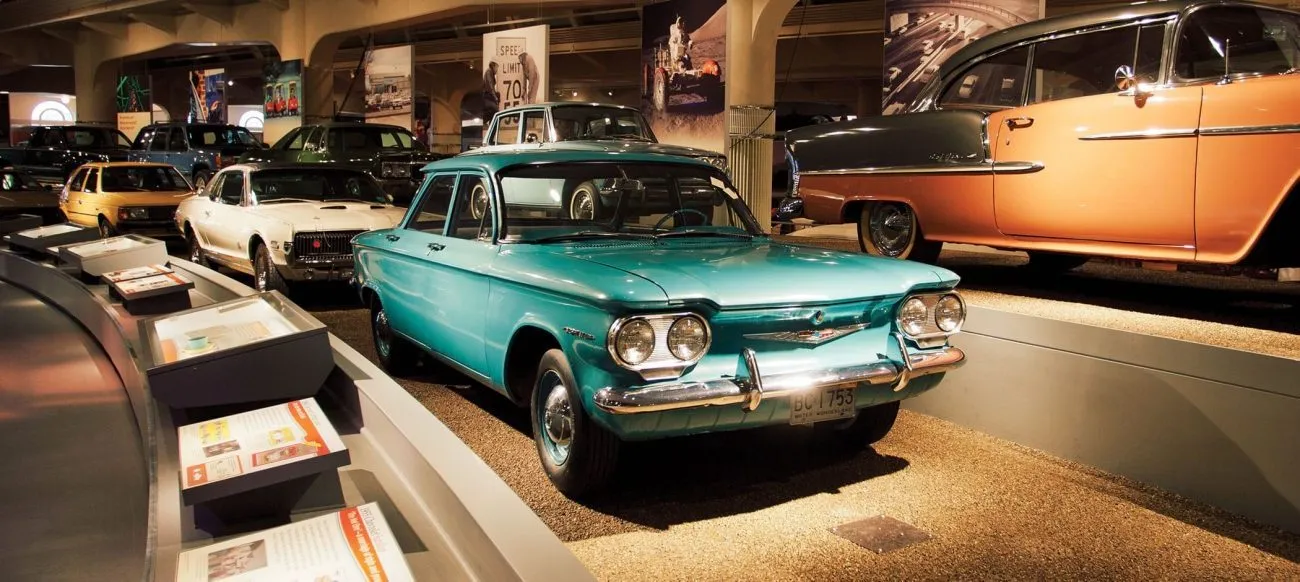 Exhibits showcasing automotive history inside The Henry Ford Museum.