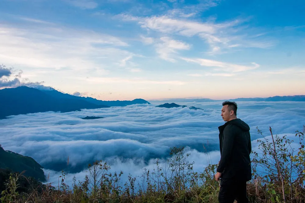 Experiencing cloud hunting from a mountain pass in Sapa, Vietnam