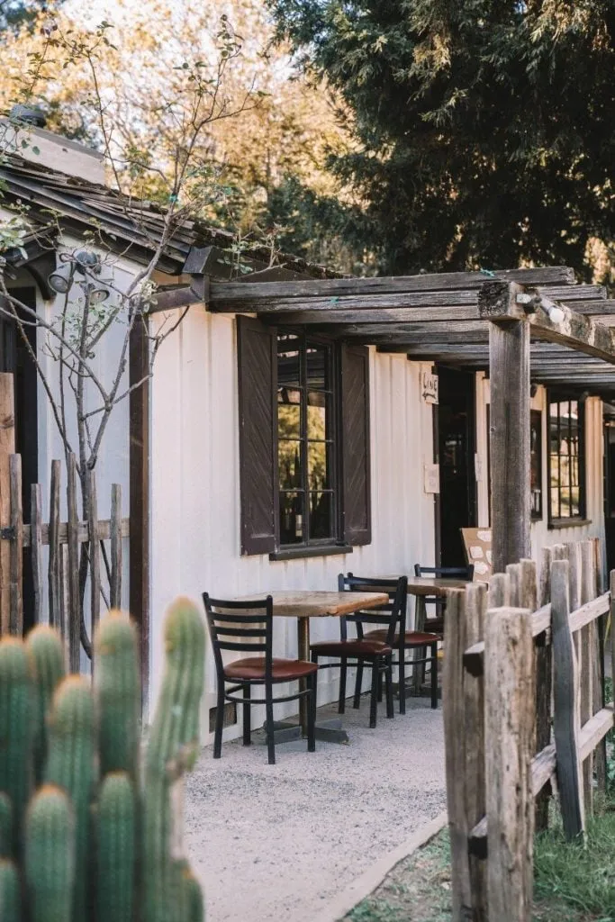 Exterior view of Big Sur Bakery with trees and outdoor seating