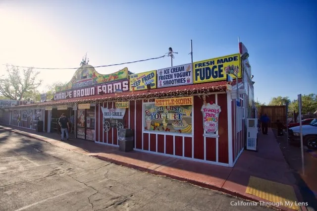 Exterior view of Charlie Brown Farms store with lots of signs