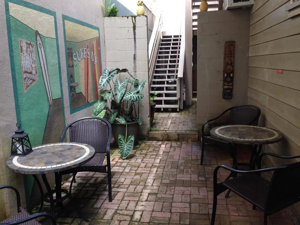 Exterior view of Hilo Bay Hostel in Hilo, Hawaii, showcasing its wooden building facade.