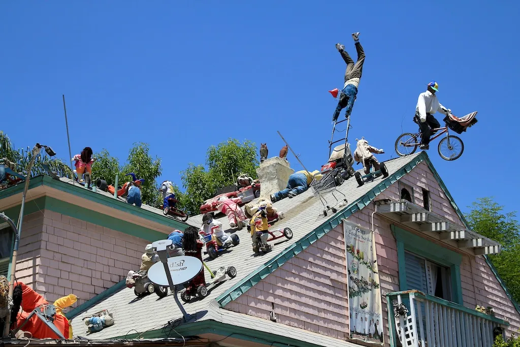 Exterior view of Tios Tacos restaurant with intricate sculptures and decorations