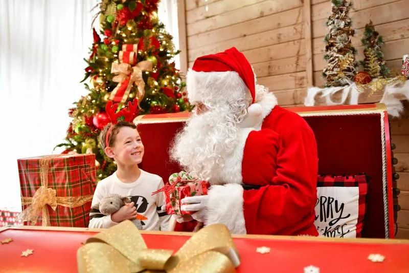 Families enjoying breakfast with Santa Claus at The Woodlands Resort