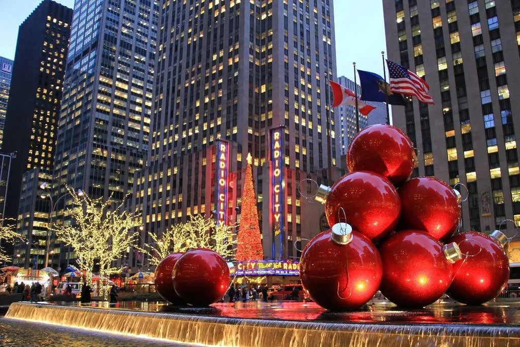 Festive lights illuminate a New York City street scene during the Christmas season, showing the magical atmosphere of what to do in NYC in December.