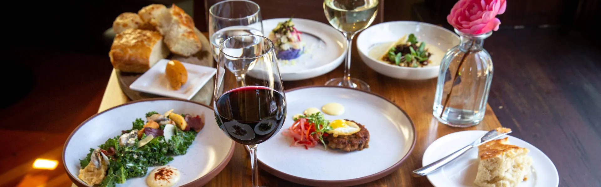Food and Wine being enjoyed at CIA Greystone in St. Helena, CA