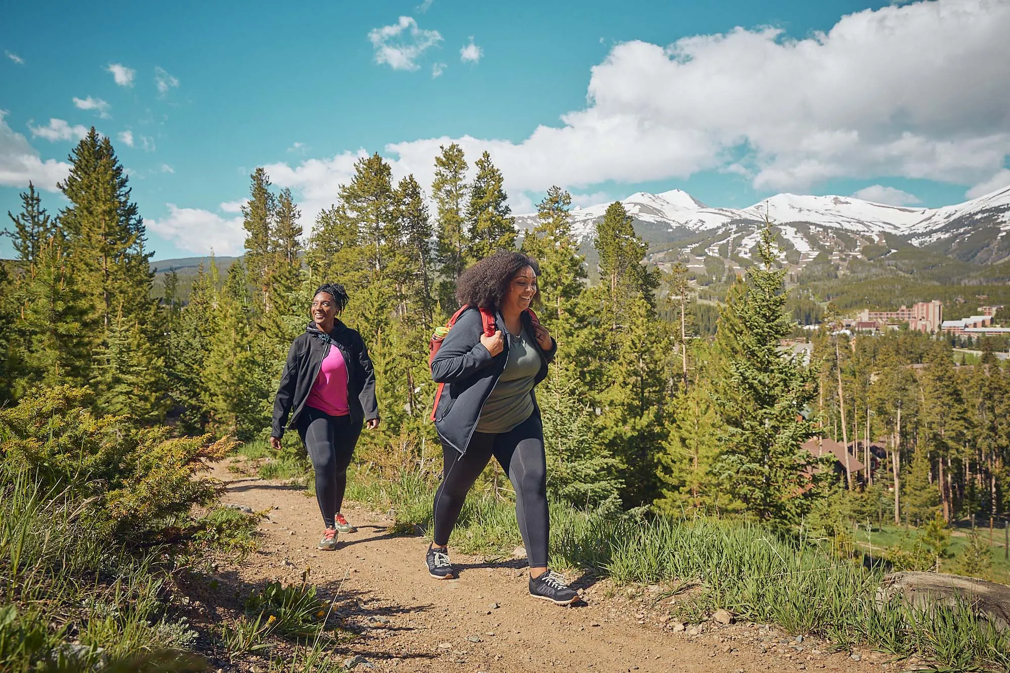 Group of friends celebrating after a summer hike on a mountain trail in Breckenridge Colorado