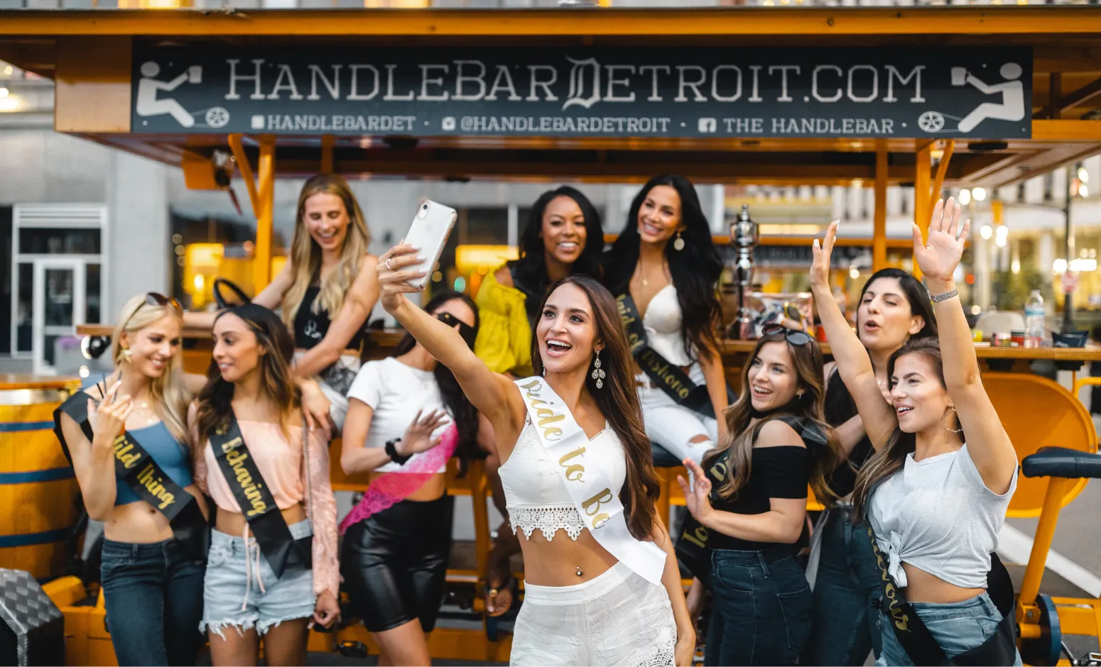 Group of people riding and pedaling on The HandleBar in Detroit, perfect for a bachelorette party