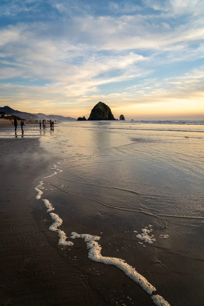 Haystack Rock at sunset on Cannon Beach, a must-see when you Explore Oregon Coast