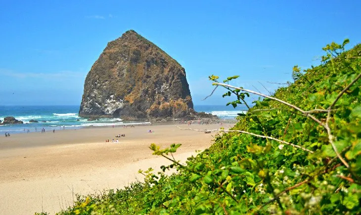 Haystack Rock standing prominently on Cannon Beach, Oregon