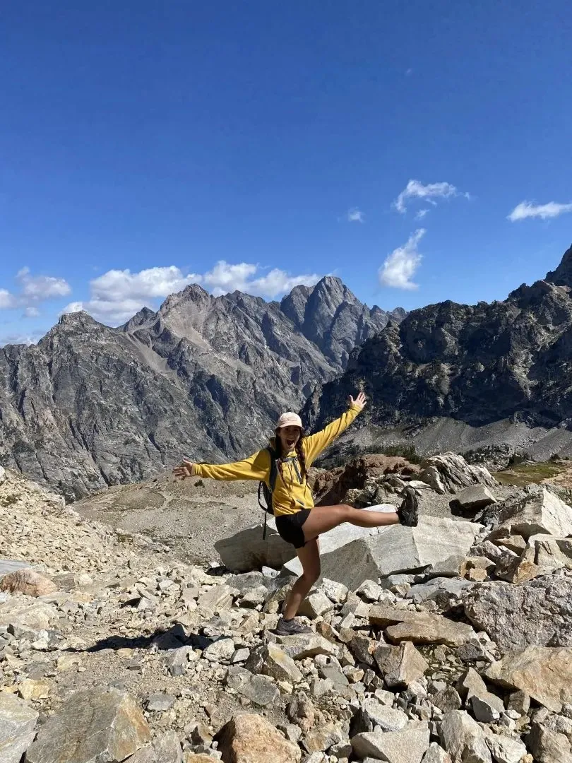 Hikers enjoying the view from Paintbrush Divide during the Paintbrush-Cascade Canyon Loop hike in Grand Teton National Park, Wyoming