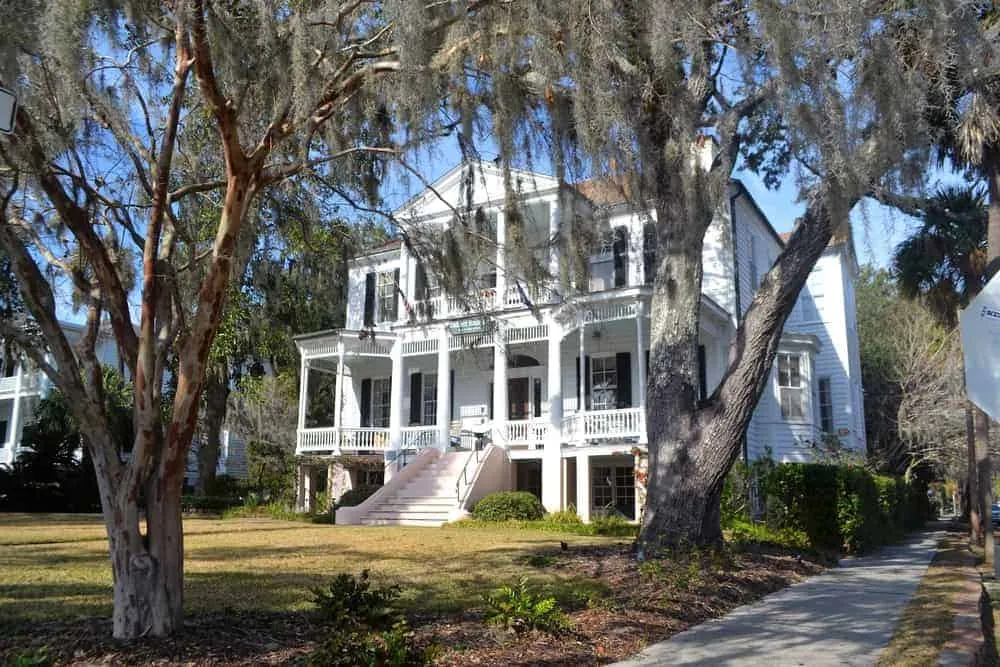 Historic Antebellum mansion with moss-draped oak trees in Beaufort