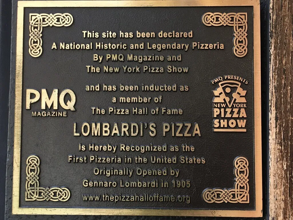 Historic plaque outside Lombardi's Pizza, America's first pizzeria