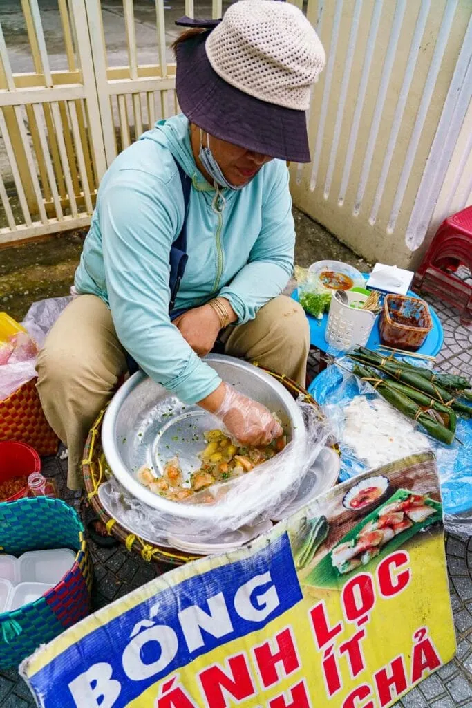Hoi An street food vendor preparing dumplings