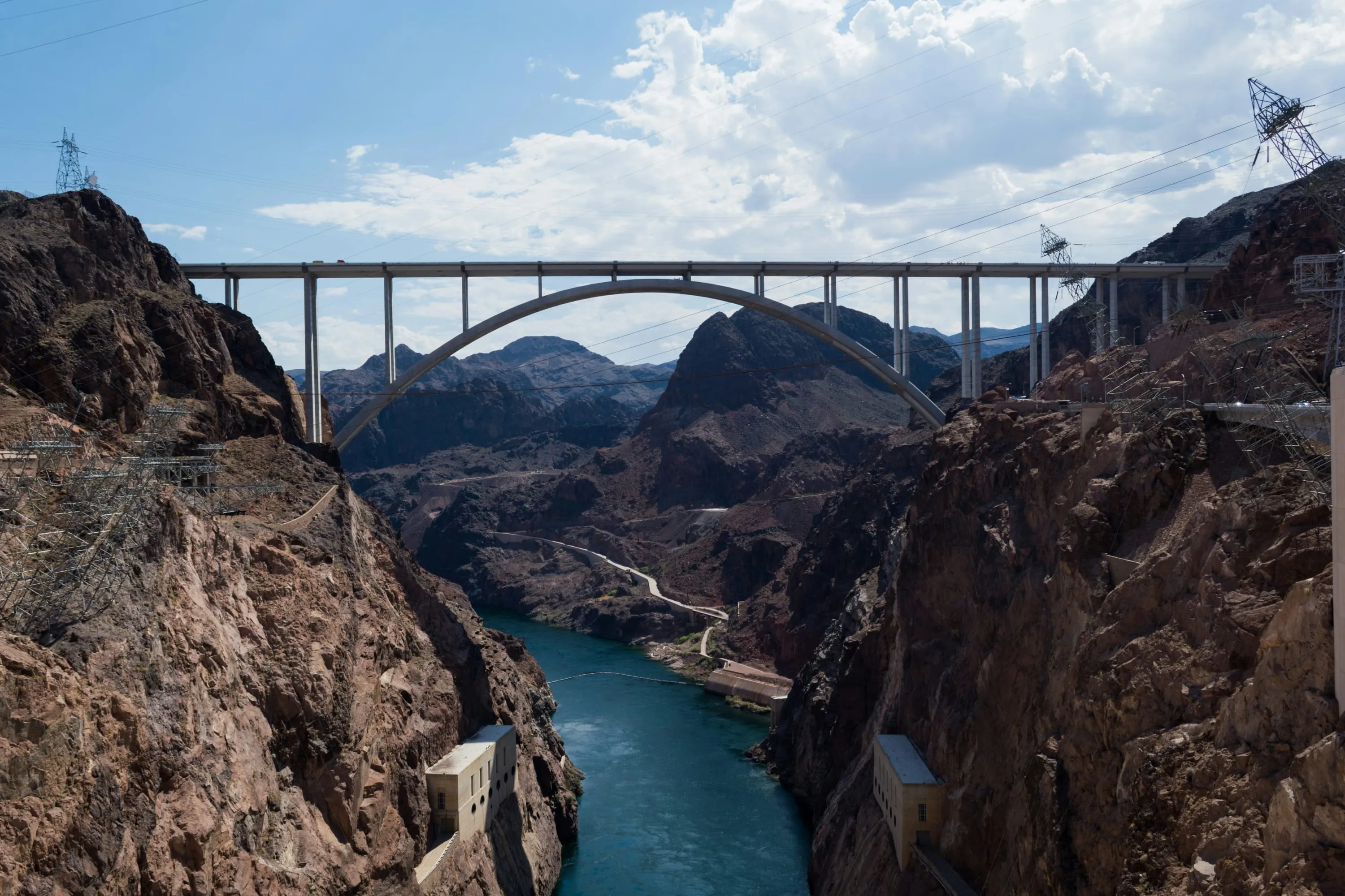 Hoover Dam bridge over the Colorado River with rocky canyon walls