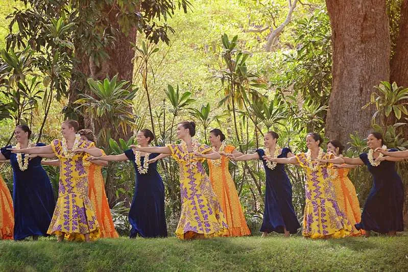 Hula dancers performing outdoors at Prince Lot Hula Festival
