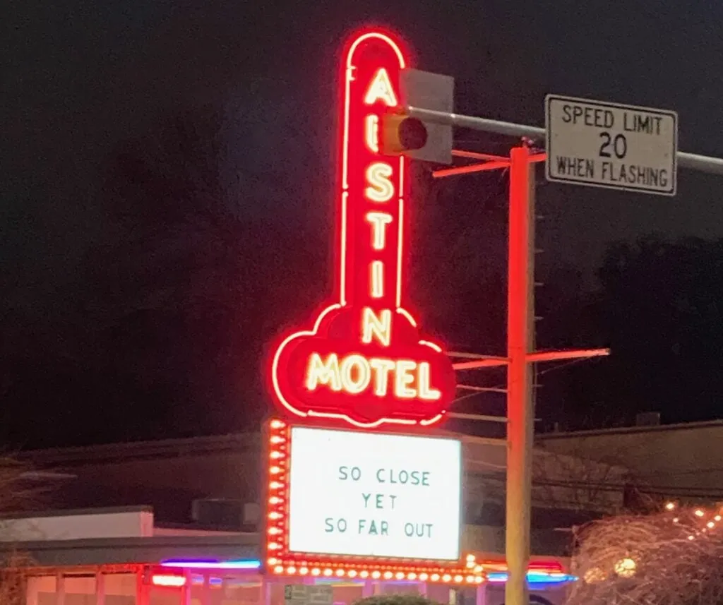 Iconic Austin Motel neon sign on South Congress Avenue, a landmark near many solo-friendly spots.