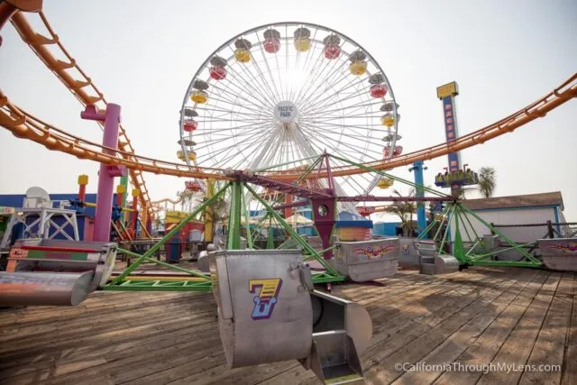 Iconic Santa Monica Pier with amusement rides and the ocean in the background