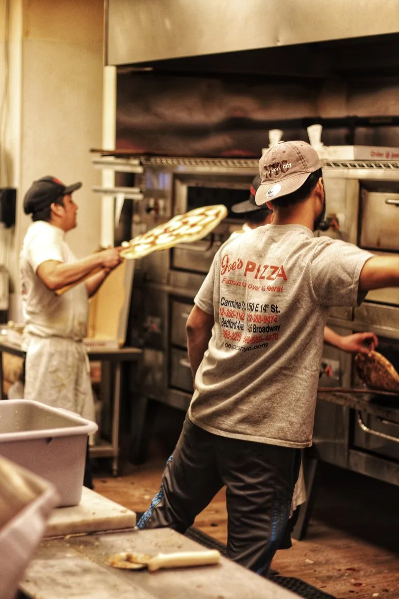 Iconic storefront of Joe's Pizza, a famous spot for New York style pizza slices