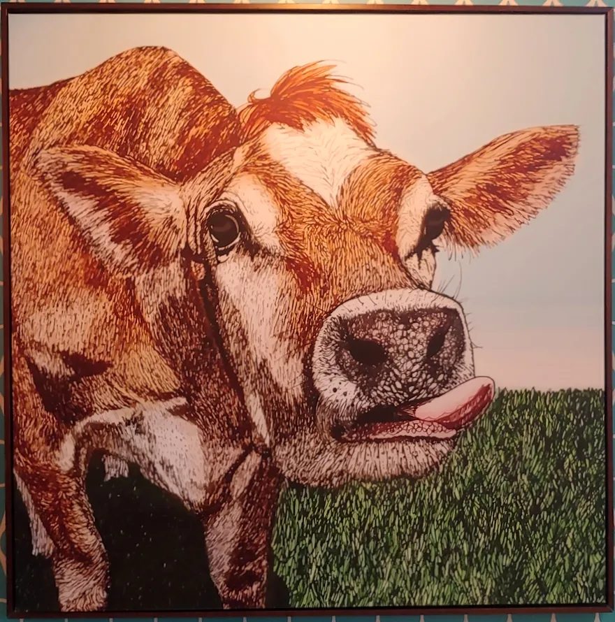 Illustration of a cow on the wall inside Lick Honest Ice Creams, highlighting their focus on fresh dairy