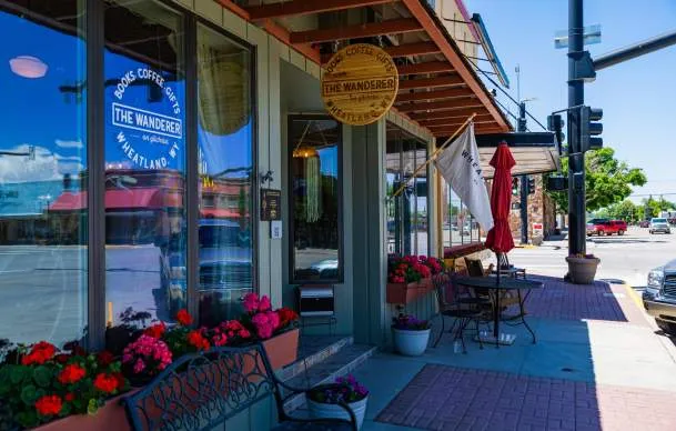 Image of a couple walking through a town in Wyoming, supporting local businesses
