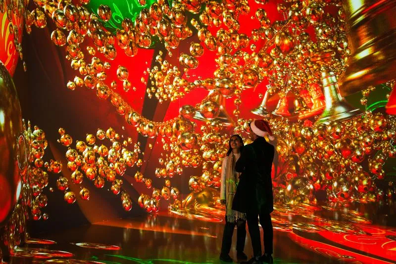 Immersive digital art installation featuring holiday themes at ARTECHOUSE Houston