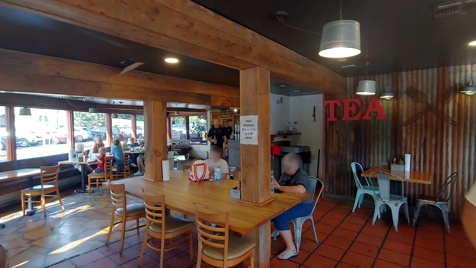 Inside dining area of Smoke Shack BBQ, showing a busy, popular atmosphere when deciding what to eat in san antonio texas