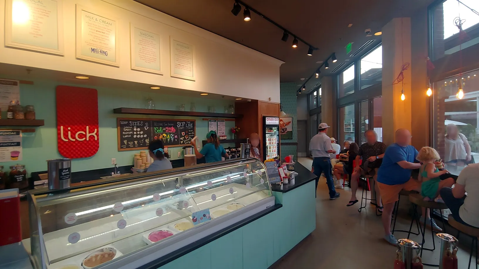 Inside view of Lick Honest Ice Creams store, bustling with customers