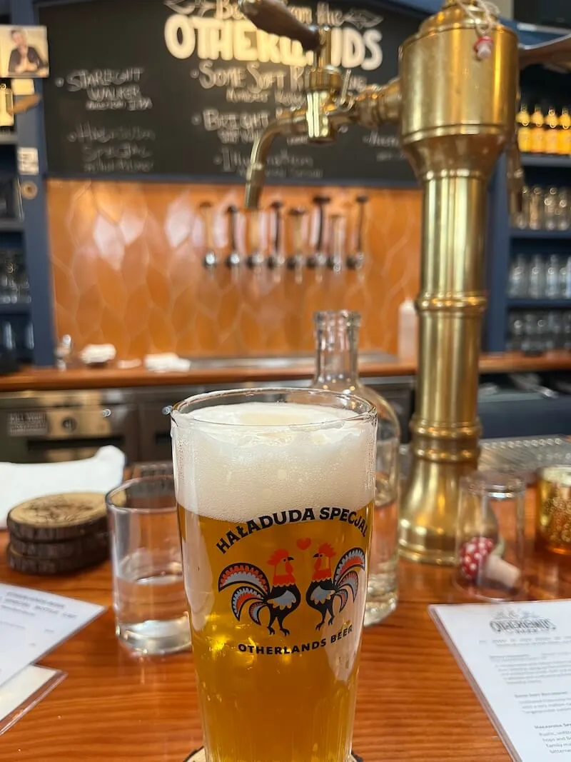 Interior of Otherlands Brewery in Bellingham with patrons enjoying drinks