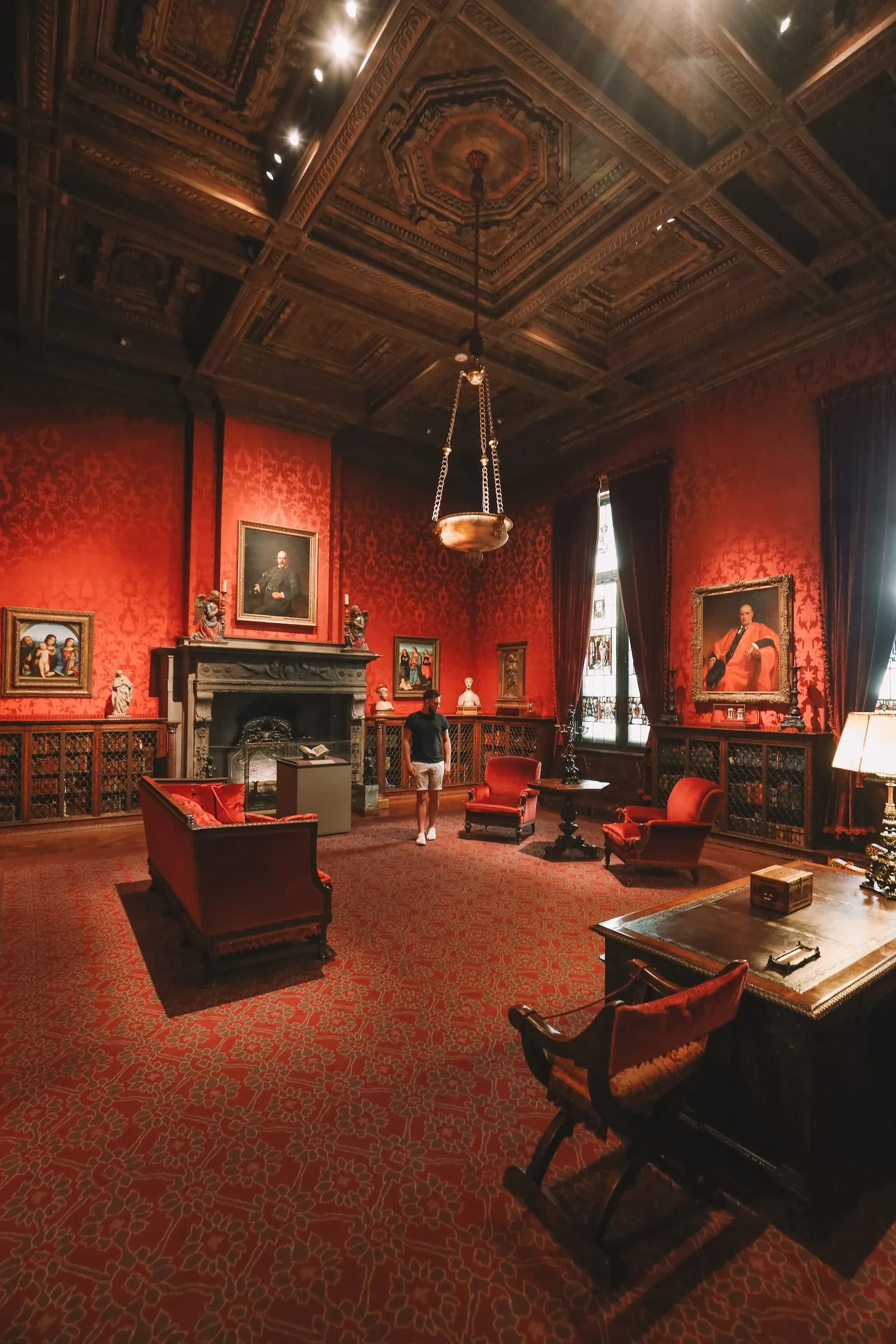 Interior of the majestic reading room in the Morgan Library with rows of books